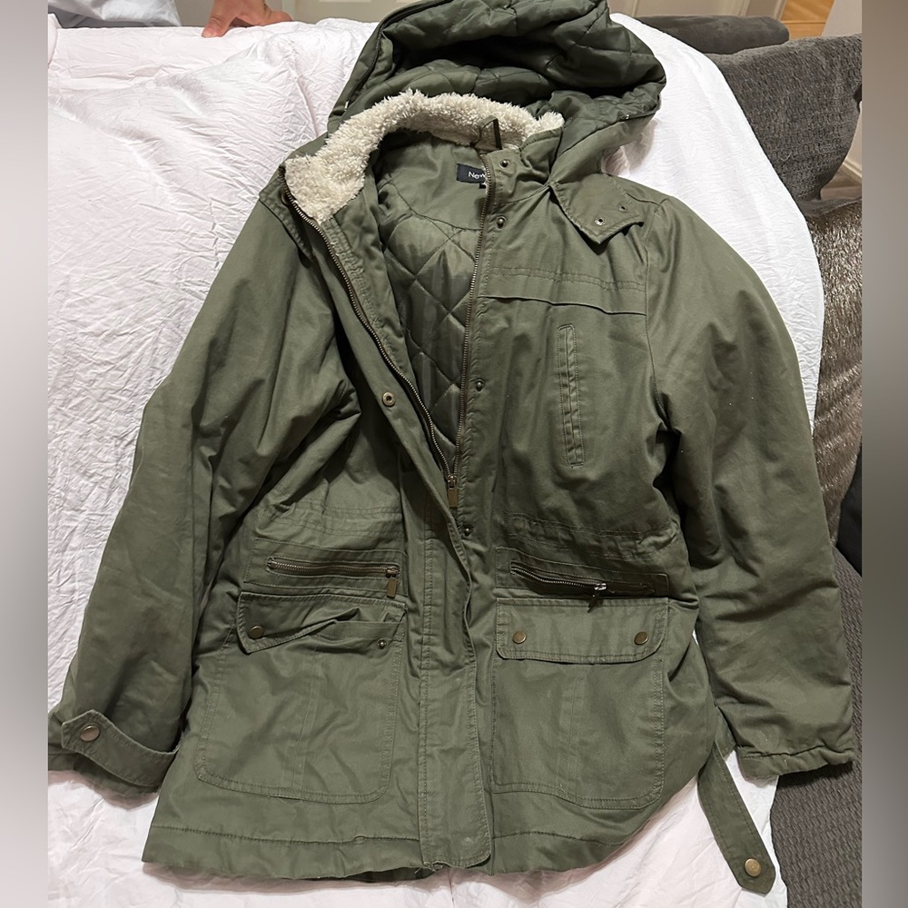 A New look dark green coat/jacket. With a white cozy fabric inside the hood.